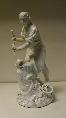 After Kaendler and Reinicke, an 18th century Meissen white glazed figure of a wheelwright, he stands