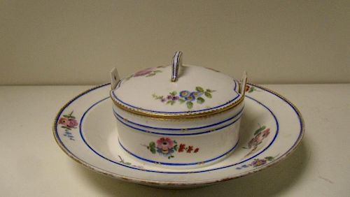A Sevres butter dish and cover, date letter for 1753, painted by Jean Baptiste Tandart with flowers