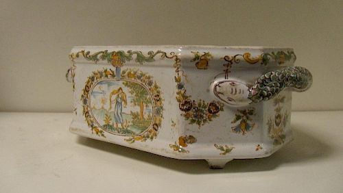An 18th century French polychrome faience planter, probably Moustiers, the canted rectangular sides