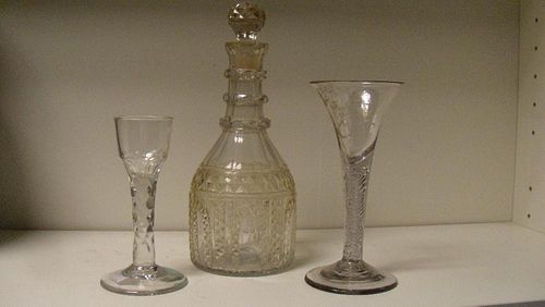 Two 18th century glasses together with an Irish decanter and stopper, the cordial with facetted stem