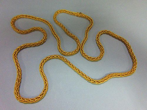 A substantial foxtail link long chain, stamped '750' for 18ct gold, the supple and textured links to