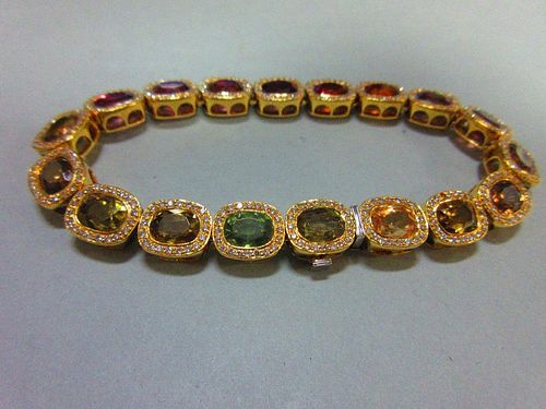 A multi gem set and diamond bracelet, each of the eighteen oval cut stones set in a border of small