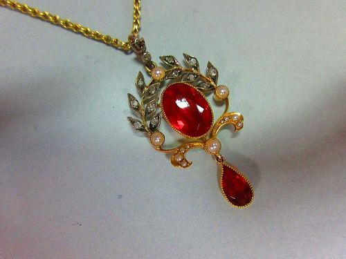 A belle époque fire opal, diamond and seed pearl pendant with chain, the oval cut fire opal collet s