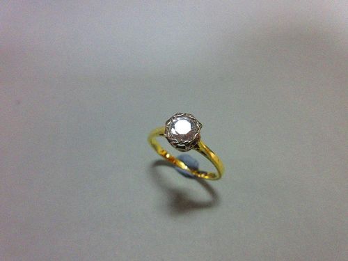 A single stone diamond ring, the illusion set round brilliant cut diamond, estimated weight 0.40cts,