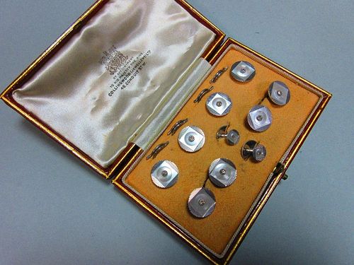 A complete diamond and mother-of-pearl dress set cased by Collingwood, comprising a pair of double-e