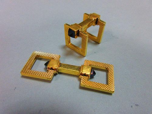 A pair of French 18ct gold and sapphire cufflinks by Mellerio, each formed as a square section centr
