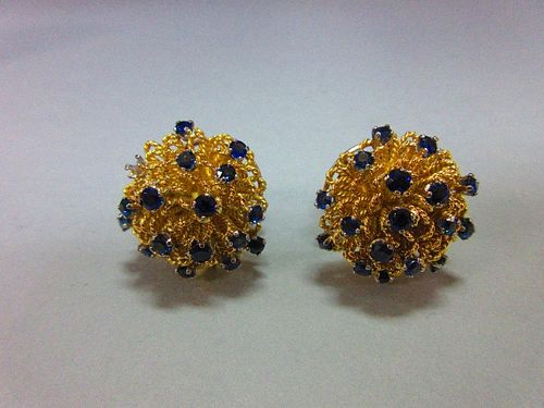 A pair of mid 20th century sapphire earrings cased by Cartier, each earstud of boss profile and form