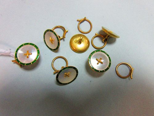 A set of six enamel and mother of pearl dress buttons, each of circular form with a rim of green ena