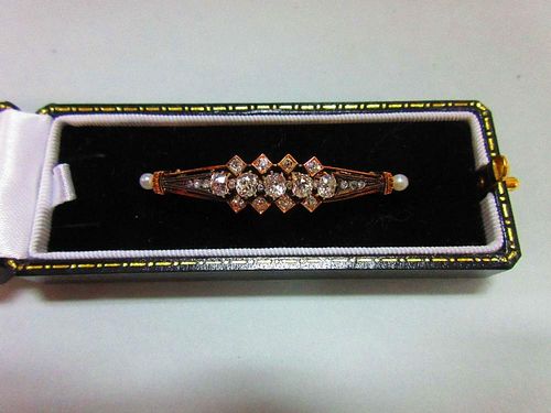 An antique diamond and pearl brooch, designed as a pierced and tapered slightly convex line with fiv