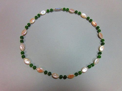 A nephrite jade and pearl necklace, individually knotted with pairs of 6.3mm nephrite jade beads spa