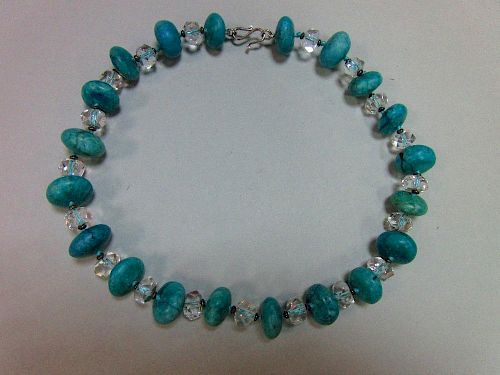 A rock crytal and turquoise howlite bead necklace, the faceted rock crystal beads alternating with r