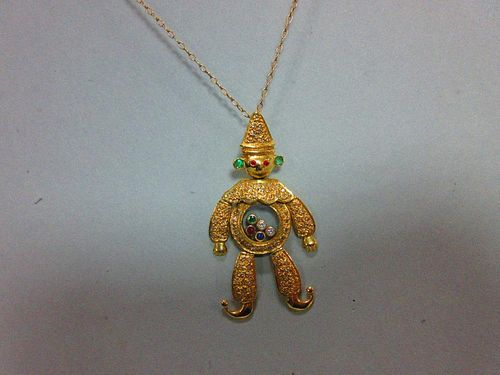 A 'happy diamond' and gem set clown pendant in the style of Chopard, the articulated figure with hat