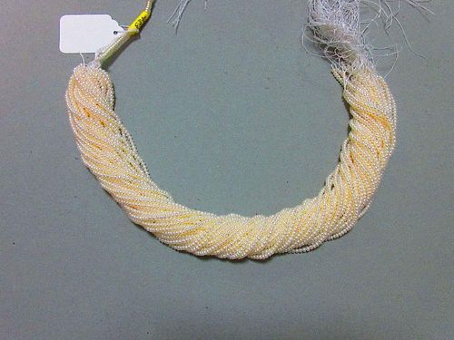 A skein of thirty three strings of 3mm cultured pearls, each string 40.5cm long, the pearls bouton s