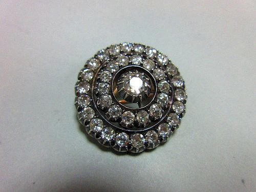 A Victorian diamond target brooch / pendant, the central old round brilliant cut diamond set above t