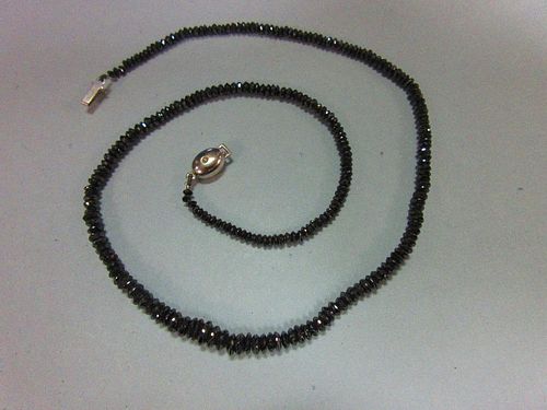 A black diamond bead necklace, the graduated 2.5 - 5.3mm diameter faceted black diamond beads, close