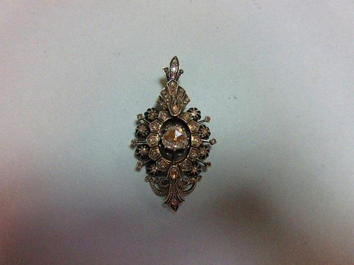 A late 19th or early 20th century diamond pendant with large central stone, of navette outline and p