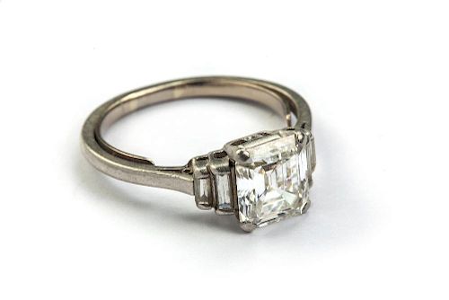 A diamond ring, the emerald cut principal stone, estimated weight 2.04cts, with two stepped baguette
