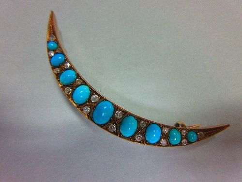 A turquoise and diamond crescent brooch, the open crescent set with graduated oval cabochon turquois