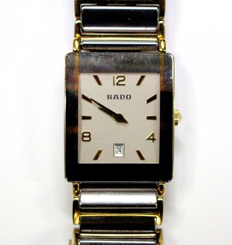 By Rado - a unisex 'Diastar' steel , titanium and gold plated quartz wristwatch, the rectangular sil