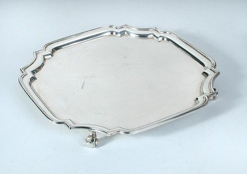 A silver salver, by the Adie Brothers, Birmingham 1939, square with shaped canted corners and moulde