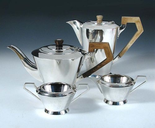 An Art Deco style silver four piece tea set, by The Barker Brothers, Birmingham 1935, comprising a c