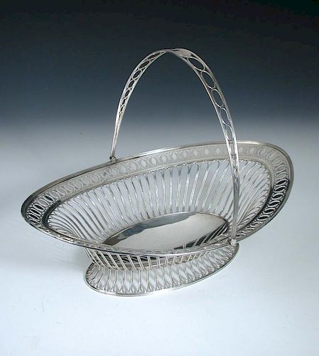 A George III silver cake basket, by Luke Proctor & Co, Sheffield 1792, of oval shape, the body and f