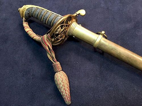 A Victorian officer's dress sword, with etched blade, unsigned, VR ciphers, pierced guard with braid