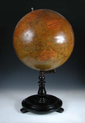 A Philips' 19 inch terrestial globe, with dark varnished gores, on an ebonised turned wood stand 81c