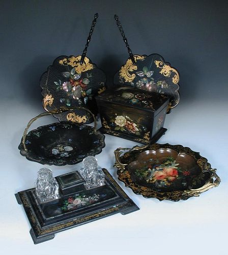 A collection of 19th century papier maché wares, comprising tea caddy, desk stand with mother-of-pea