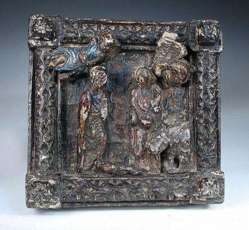 A 16th century Continental carved chestnut and polychrome decorated panel of the Nativity, the squar