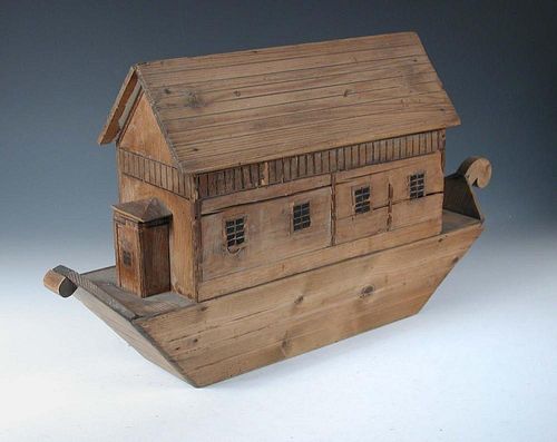 A late 19th or early 20th century pine model of Noah's Ark, the sliding back opening to reveal an ar