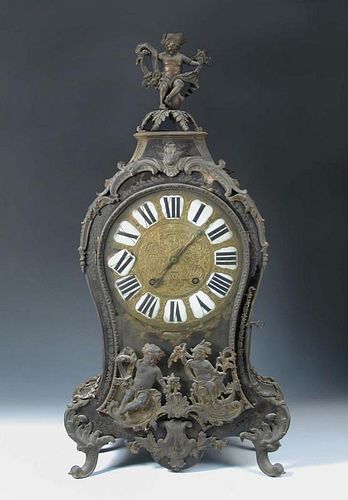 A French 18th century Boullework mantel clock, the waisted case with gilt metal mounts, enamelled nu