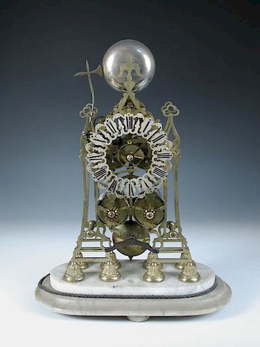 A Victorian brass skeleton clock, the spire top case with bell above pierced silvered chapter ring h