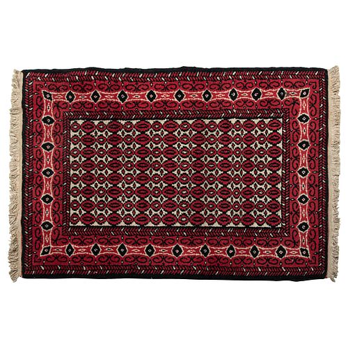 Tapete Temoaya. México, SXX. Anudado a mano en fibras de lana. Decorado con motivos geométricos en tonos rojos, negros y beige.