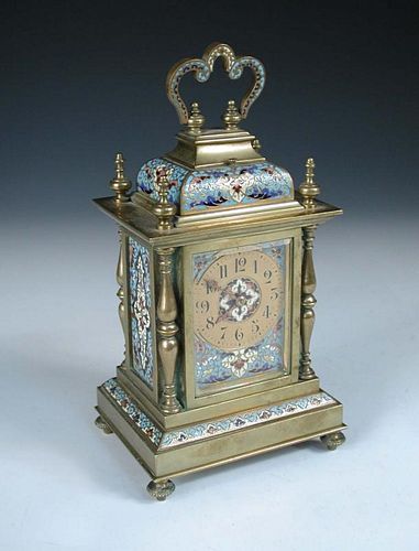 A late 19th century brass and enamelled mantle clock, with folding handle above repeat button, doubl