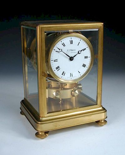 An early Atmos mantle clock by J. L. Reutter, serial no. 123, the bevelled glazed gilt frame case wi