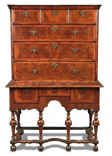 An early 18th century walnut chest on stand, banded border decoration to the drawer fronts and sides