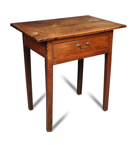 An 18th century oak side table, a patinated cleated plank top with single drawer, on tapering square
