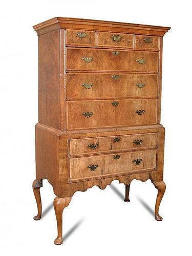 An 18th century and later walnut chest on stand, with alterations, fitted three small and three long