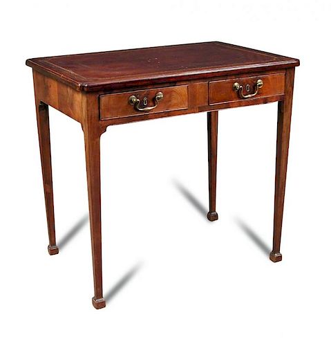 A George III mahogany writing table, leather lined top with re entrant corners, fitted two drawers,