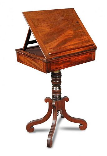 A Regency mahogany reading table, with adjustable slope, fitted end drawer for ink wells and pens, o