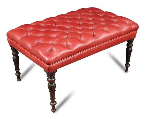 A red leather upholstered footstool, buttoned seat on carved mahogany and turned legs 48 x 92 x 60cm