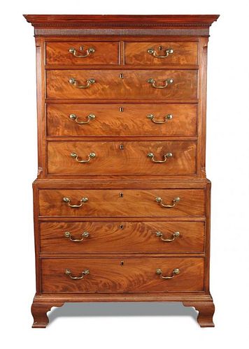 A George III mahogany chest on chest, with dentil moulded cornice, canted reeded sides, fitted two s
