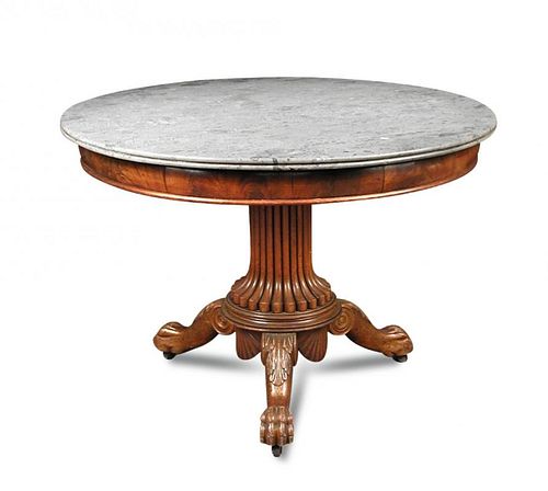 A Louis Phillipe marble top mahogany pedestal table, the freize with repeated flame figured veneers,