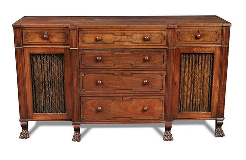 A Regency mahogany breakfront cabinet, fitted central drawers, ebony line border inlays and flanked