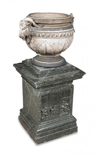A 19th century Blashfield type terracotta urn, moulded with Ram's head handles, on a marble plinth i
