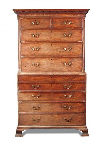 A George III mahogany secretaire chest on chest, with a greek key moulded cornice, canted reeded sid