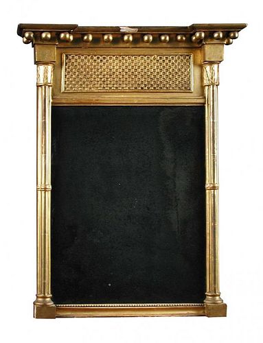 A small Regency gilt framed pier glass, with a ball moulded frieze and cluster moulded column sides