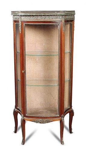 A late 19th century French gilt mounted mahogany vitrine, circa 1900, the galleried marble top above