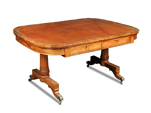A George IV rosewood library table, leather lined top, fitted two blind frieze drawers, on reeded an
